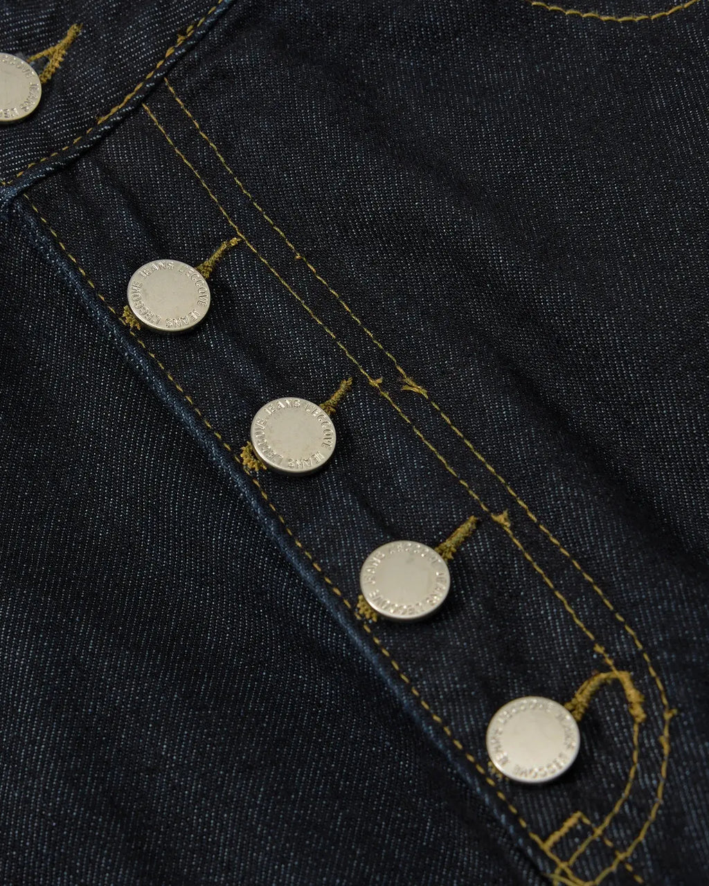 INFLATION Cinch Back Buttons Up Cargo Jorts featuring a relaxed fit, cargo pockets, and stylish button details on denim shorts.