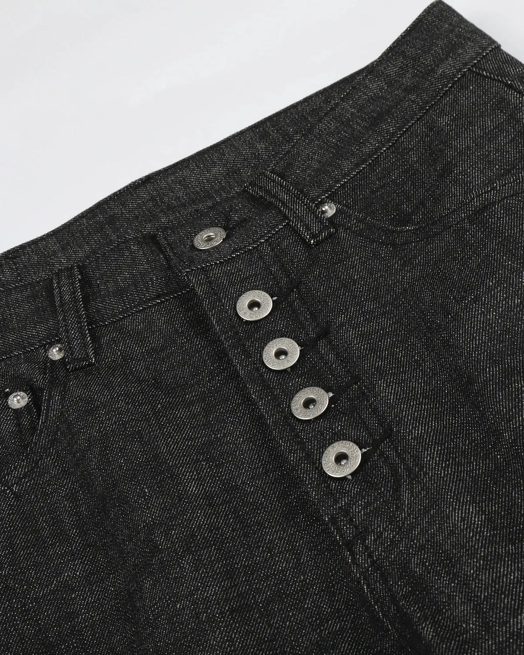 Deconstructed raw baggy jeans with button details from Inflation Streetwear, featuring relaxed fit and distressed denim style.