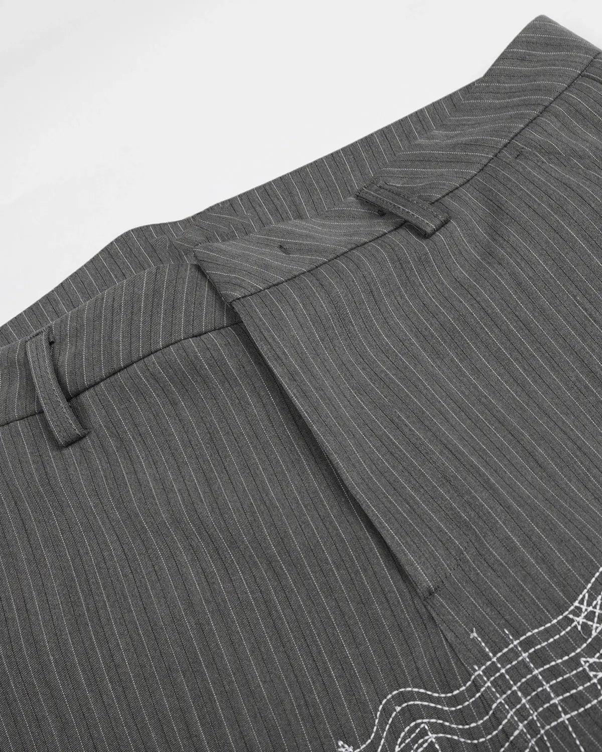 Pinstripe cinch back tailored pants by INFLATION featuring a sleek fit and stylish design, shown on a model.