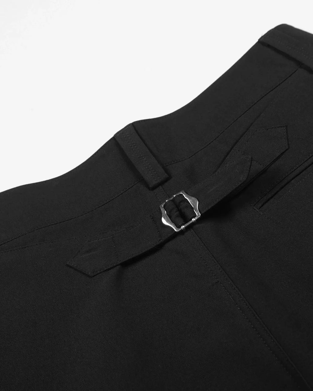 Inflation Streetwear pleated cinch back tailored shorts in beige with a high waist and tailored fit, shown from the front.