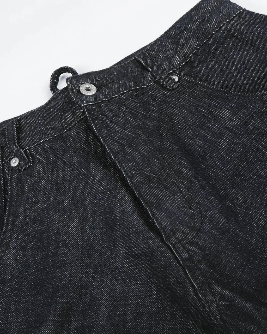 Cinch back raw baggy jeans by INFLATION streetwear with relaxed fit, raw denim, and oversized style, shown on a model.