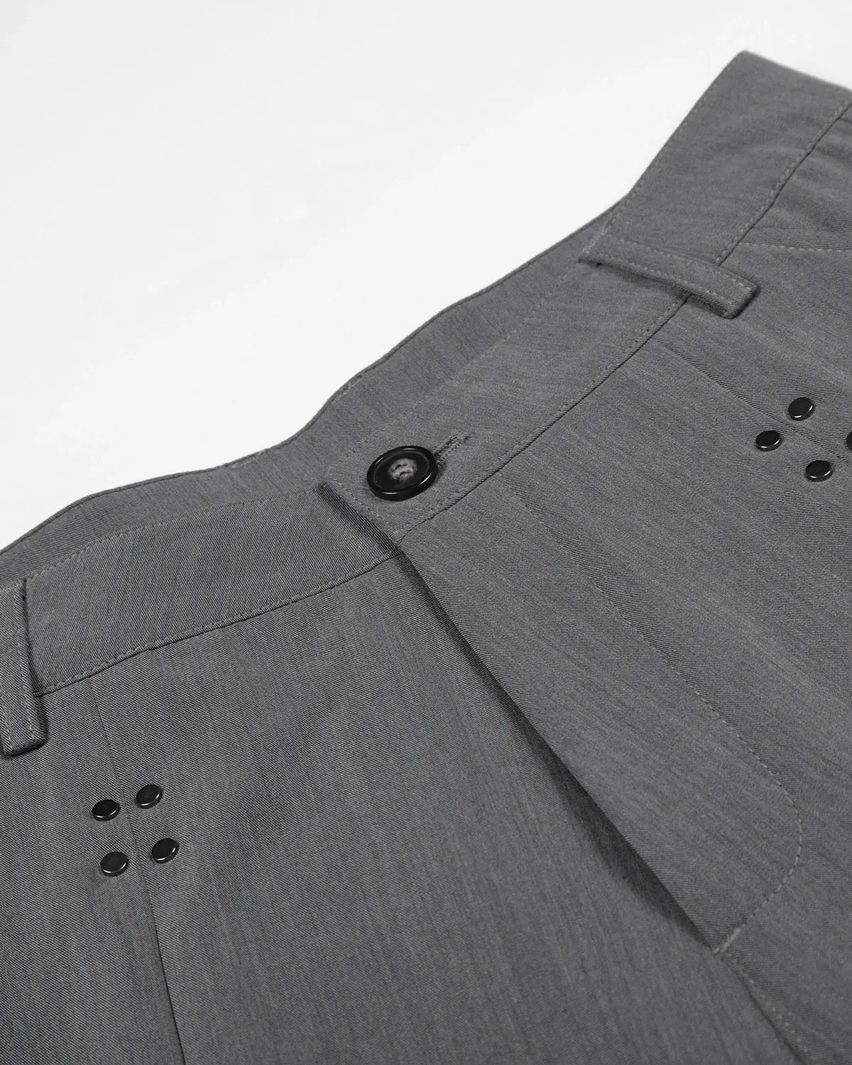 Inflation streetwear pleated tailored shorts with stud details, featuring a stylish, structured design and high-quality fabric.