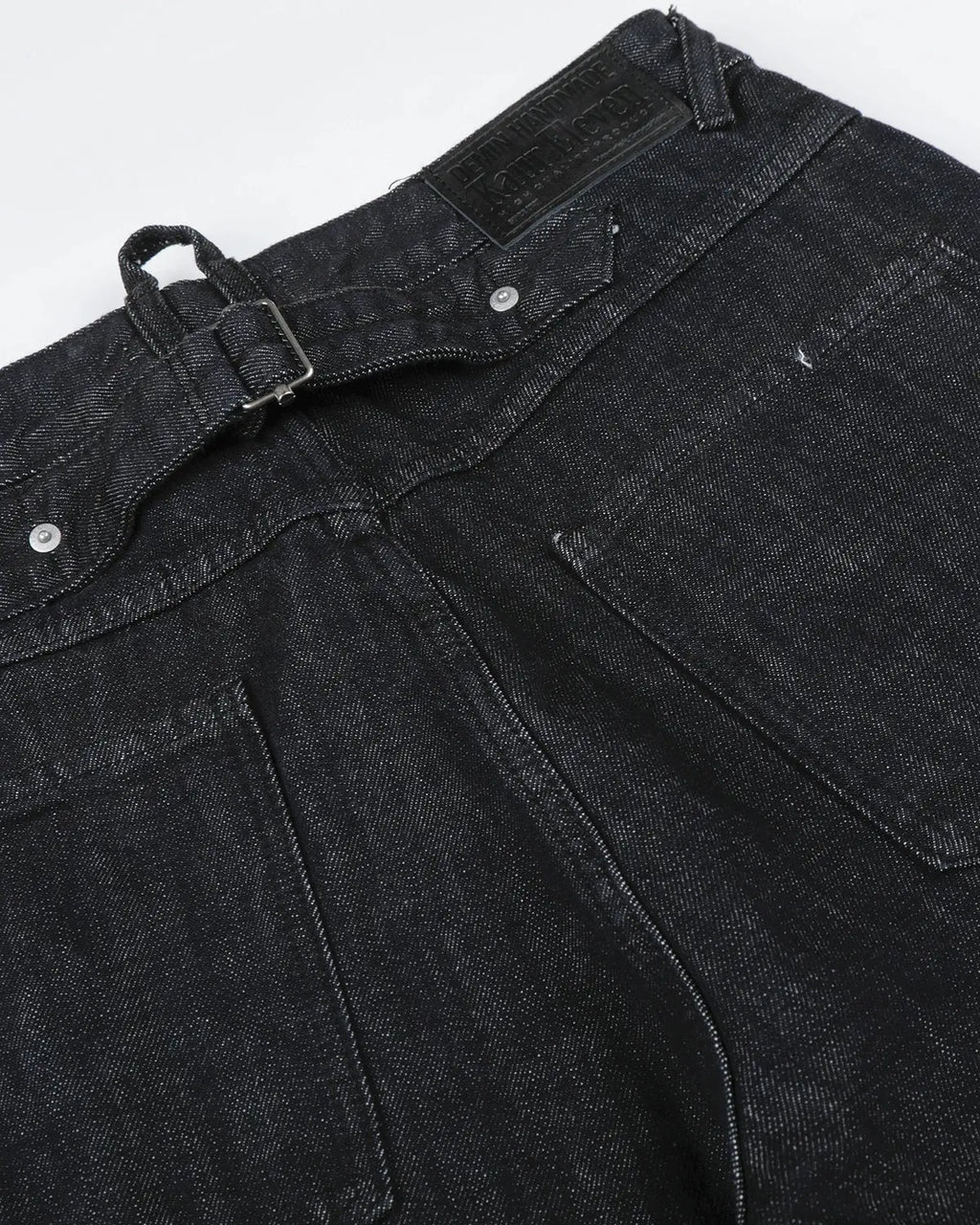 Cinch back raw baggy jeans by INFLATION Streetwear, featuring a relaxed fit and distressed denim style.