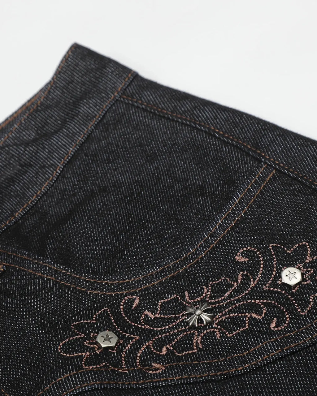 Vintage embroidered bootcut jeans by INFLATION, showcasing intricate embroidery details and classic denim fit.