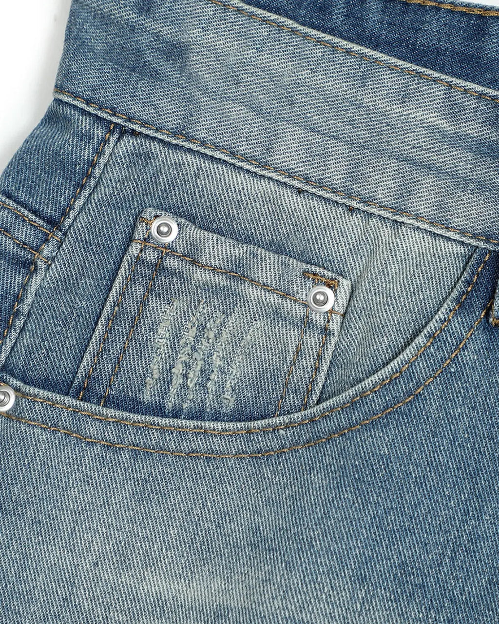 Distressed washed knee-length jorts by INFLATION, casual denim pants with frayed edges and a relaxed fit.