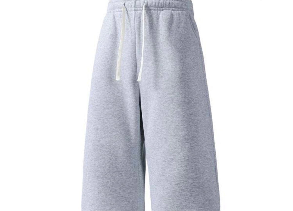 Flation Trending Long Jogger Shorts in black, featuring a relaxed fit, elastic waistband, and casual style for comfortable wear.
