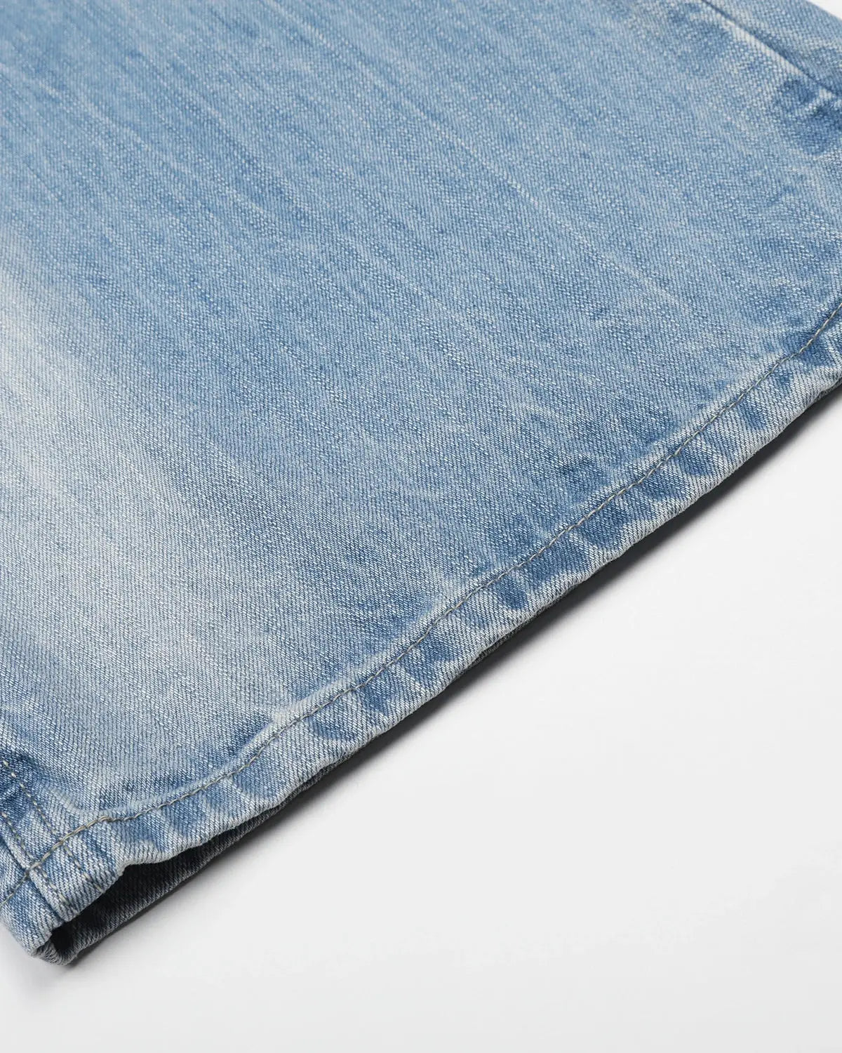 Vintage whiskered bootcut jeans by INFLATION Streetwear, showing distressed denim with whisker fade and classic bootcut fit.