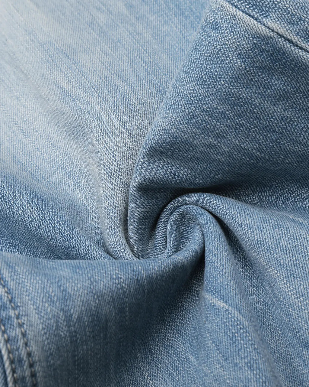 Vintage whiskered bootcut jeans by INFLATION Streetwear, showing distressed denim with faded whisker details and classic bootcut fit.