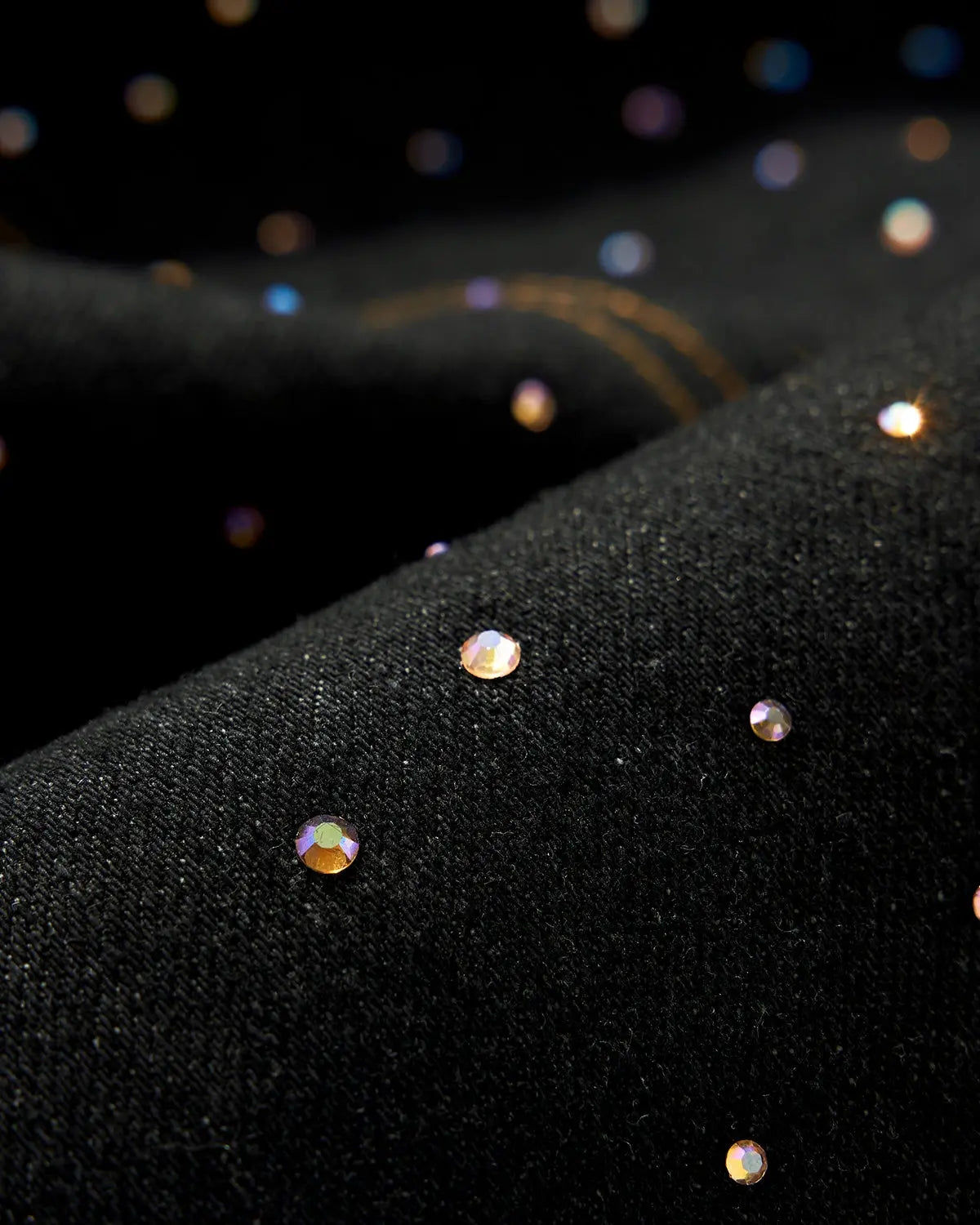 Colorful rhinestone raw barrel jeans by Flation Streetwear featuring vibrant embellishments and distressed denim detail.