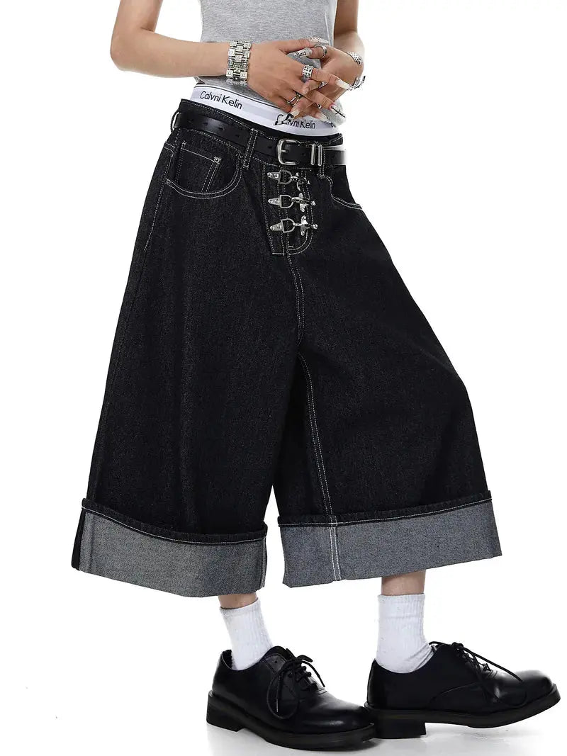 Inflation streetwear buckle detail raw denim jorts, casual pants with distressed finish and metal buckle accents.