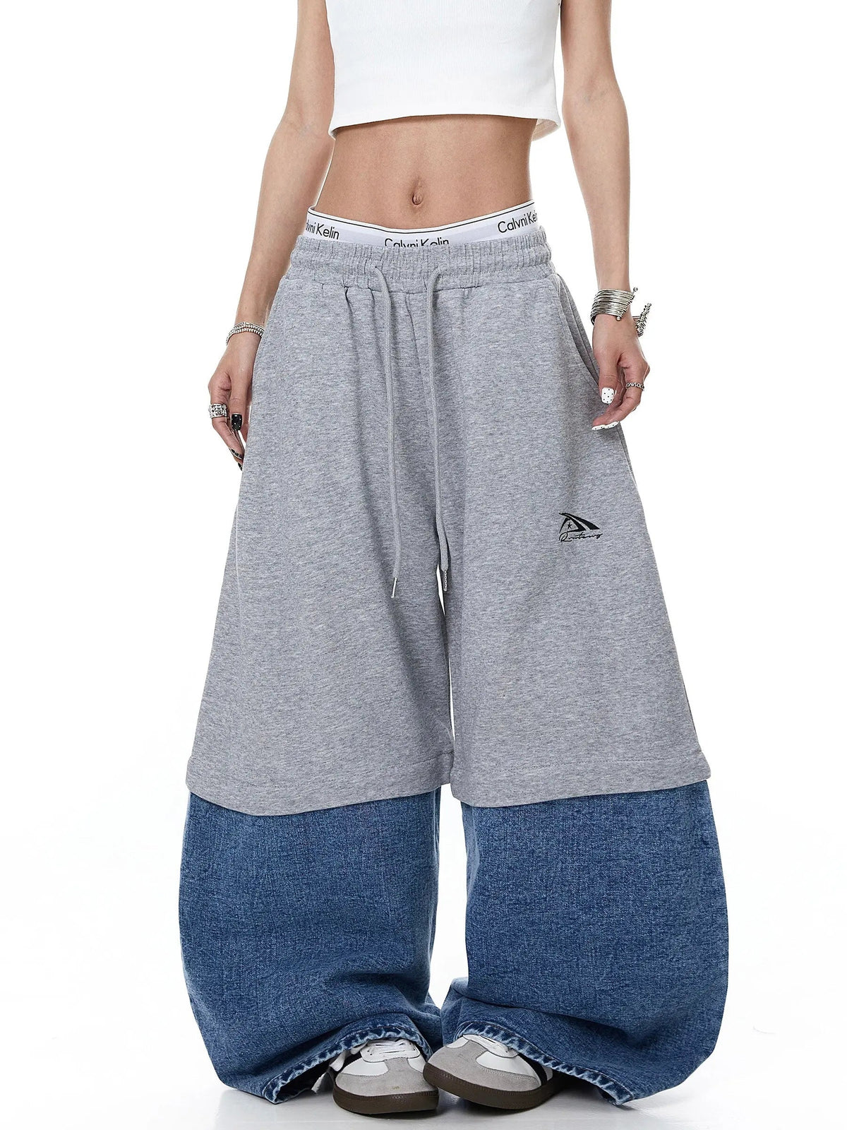 Denim detachable patchwork barrel joggers by INFLATION, featuring a relaxed fit and stylish patchwork design.