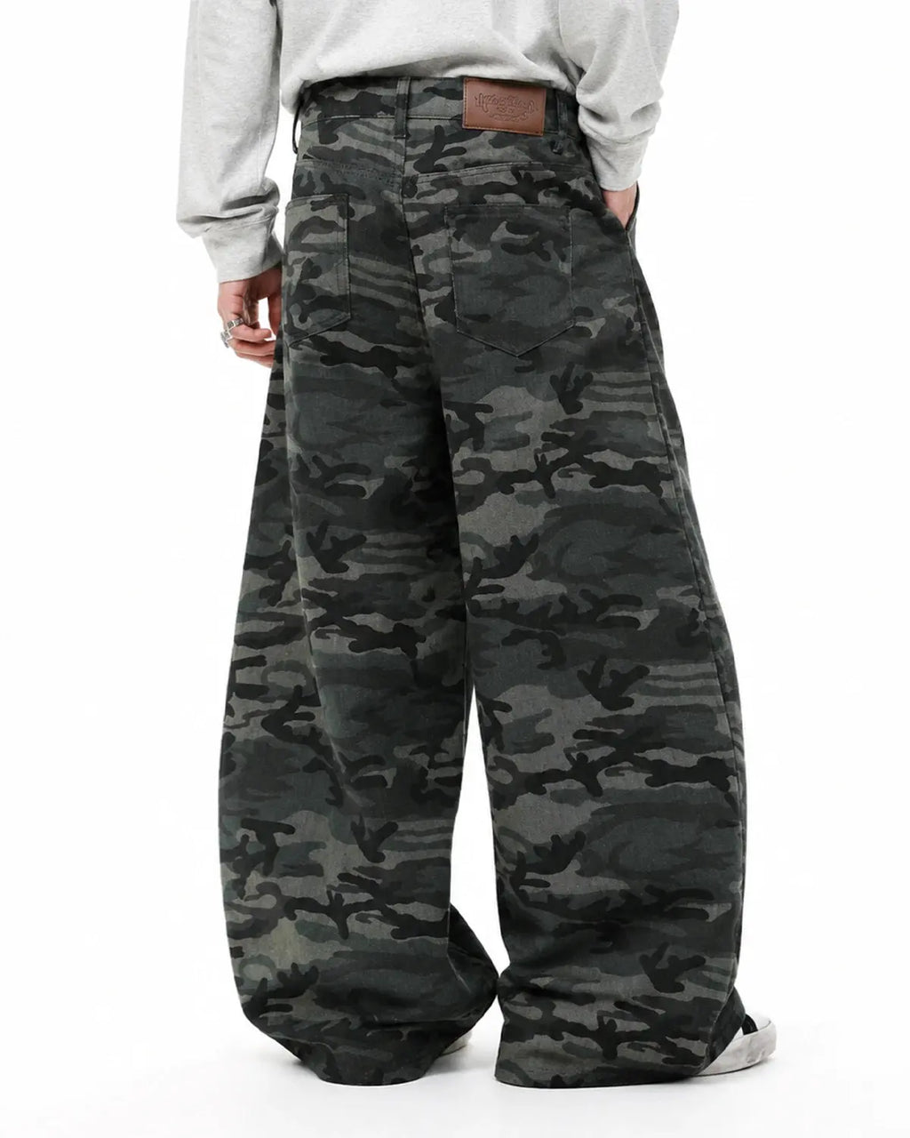 Inflation brand rhinestone camo barrel pants with rhinestone detailing, stylish streetwear pants on a model.