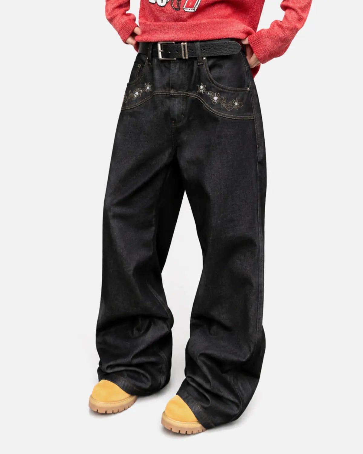 Vintage embroidered bootcut jeans by INFLATION, showcasing detailed embroidery and classic denim fit on a model.