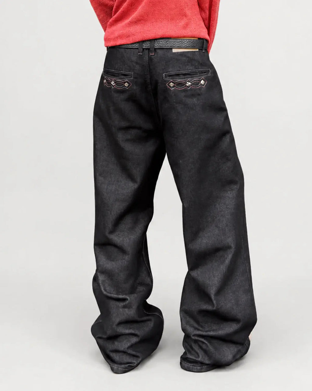 Vintage embroidered bootcut jeans by INFLATION featuring detailed embroidery and classic denim style.