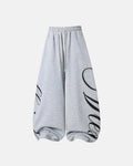 Inflation Streetwear Rhinestone Script Baggy Sweatpants with shiny rhinestone details and relaxed fit, black color, front view.