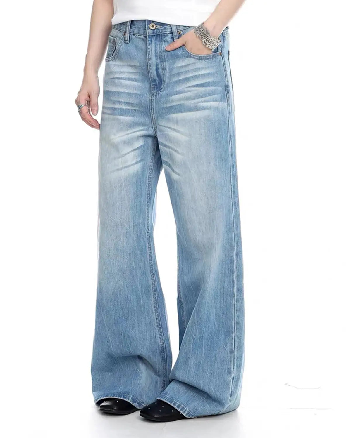 Vintage whiskered bootcut jeans from Inflation Streetwear featuring faded denim and classic fit, displayed on a hanger.