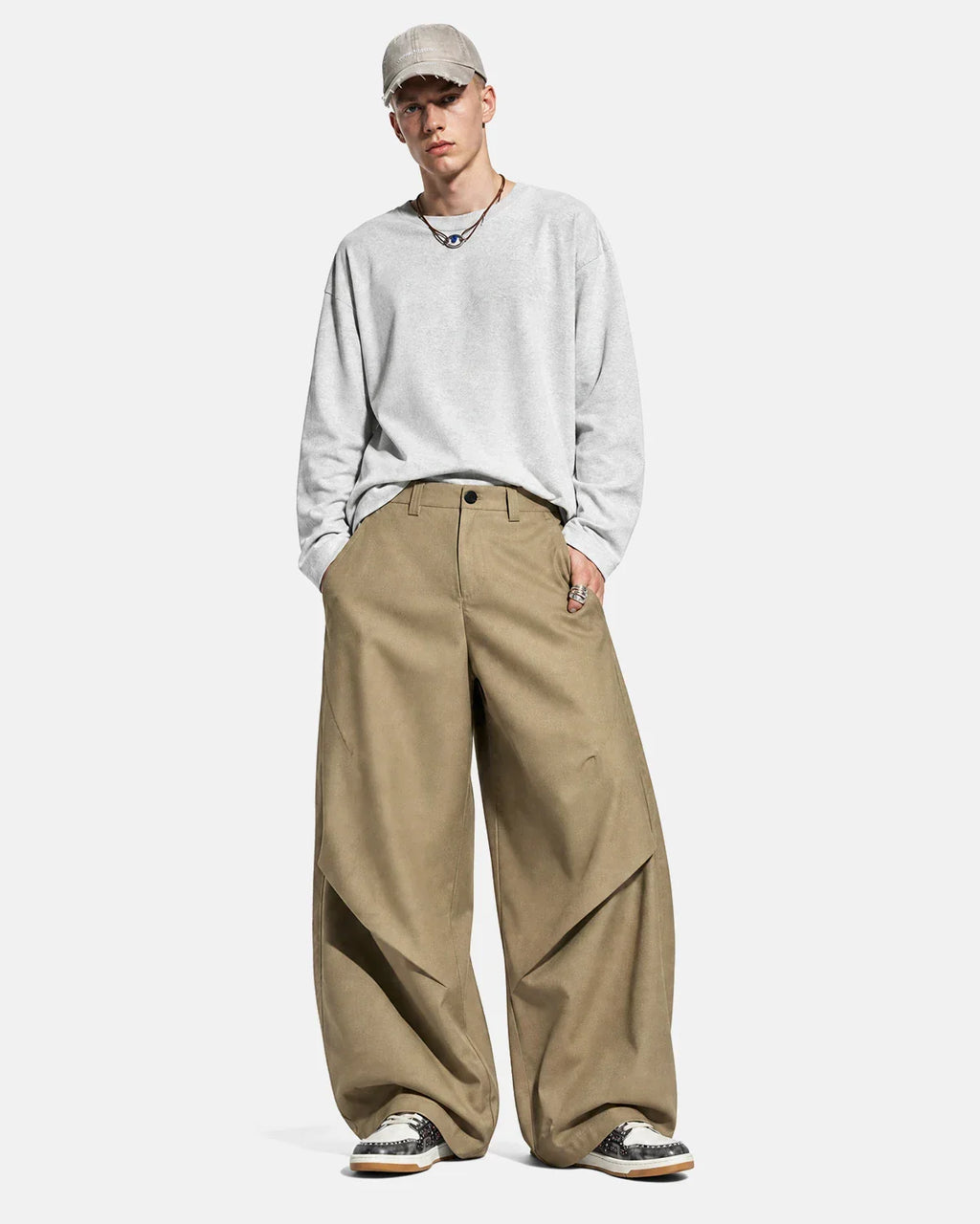 Flation Pleated Barrel Tailored Pants, stylish streetwear pants with a pleated design and relaxed fit, shown in dark fabric.