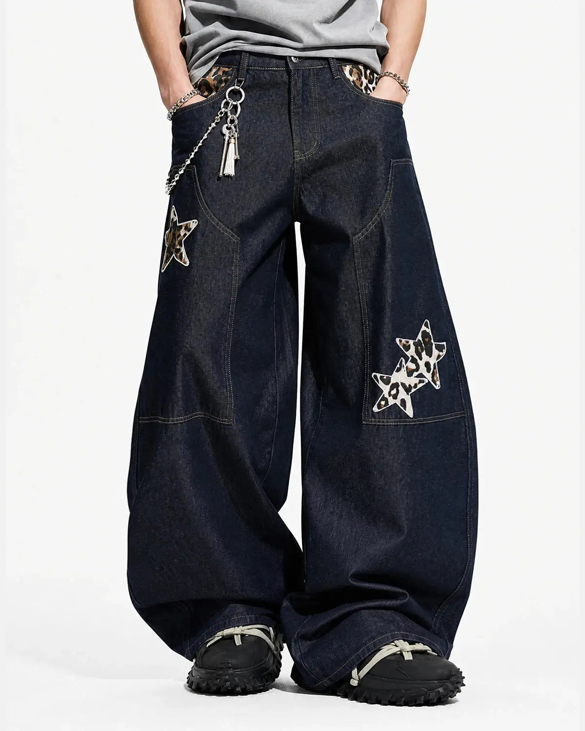 Inflation Streetwear leopard star patch barrel jeans showing distressed denim with leopard and star patches on the legs.