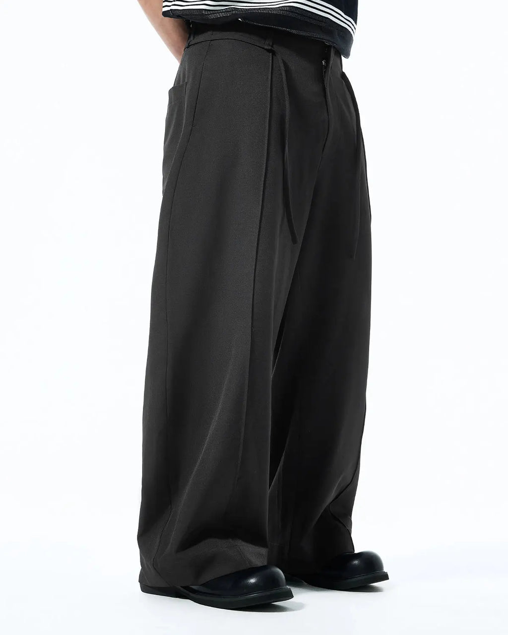 Light gray Cleanfit Baggy Suit Pants by Flation Streetwear with a relaxed fit and casual style, shown on a model.