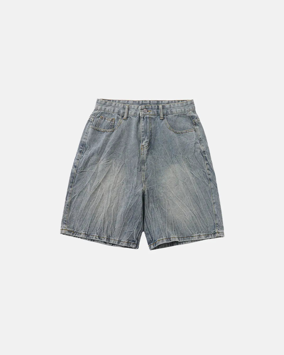 Textured washed longline jorts by INFLATION, denim-style pants with a relaxed fit and distressed finish, shown on a model.