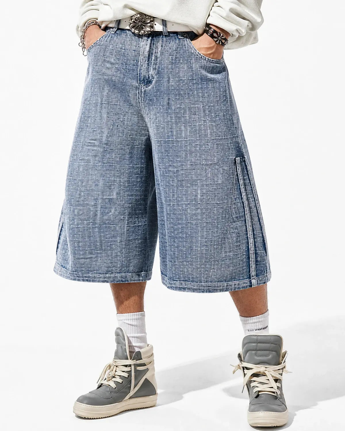 Inflation Streetwear grid texture baggy jorts with relaxed fit and distressed denim look, displayed on a model.