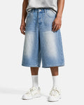 Blue rhinestone baggy jeans shorts by Flation, featuring distressed denim and loose fit, styled with visible rhinestone details.