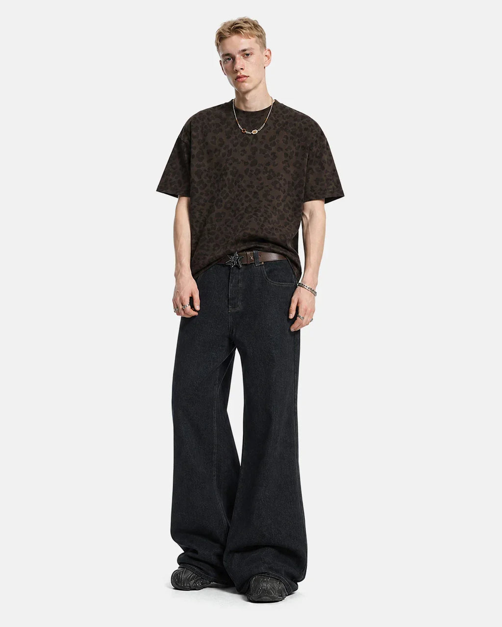 Flation Super Raw Flared Baggy Jeans with distressed details, showcasing relaxed fit and streetwear style on a model.