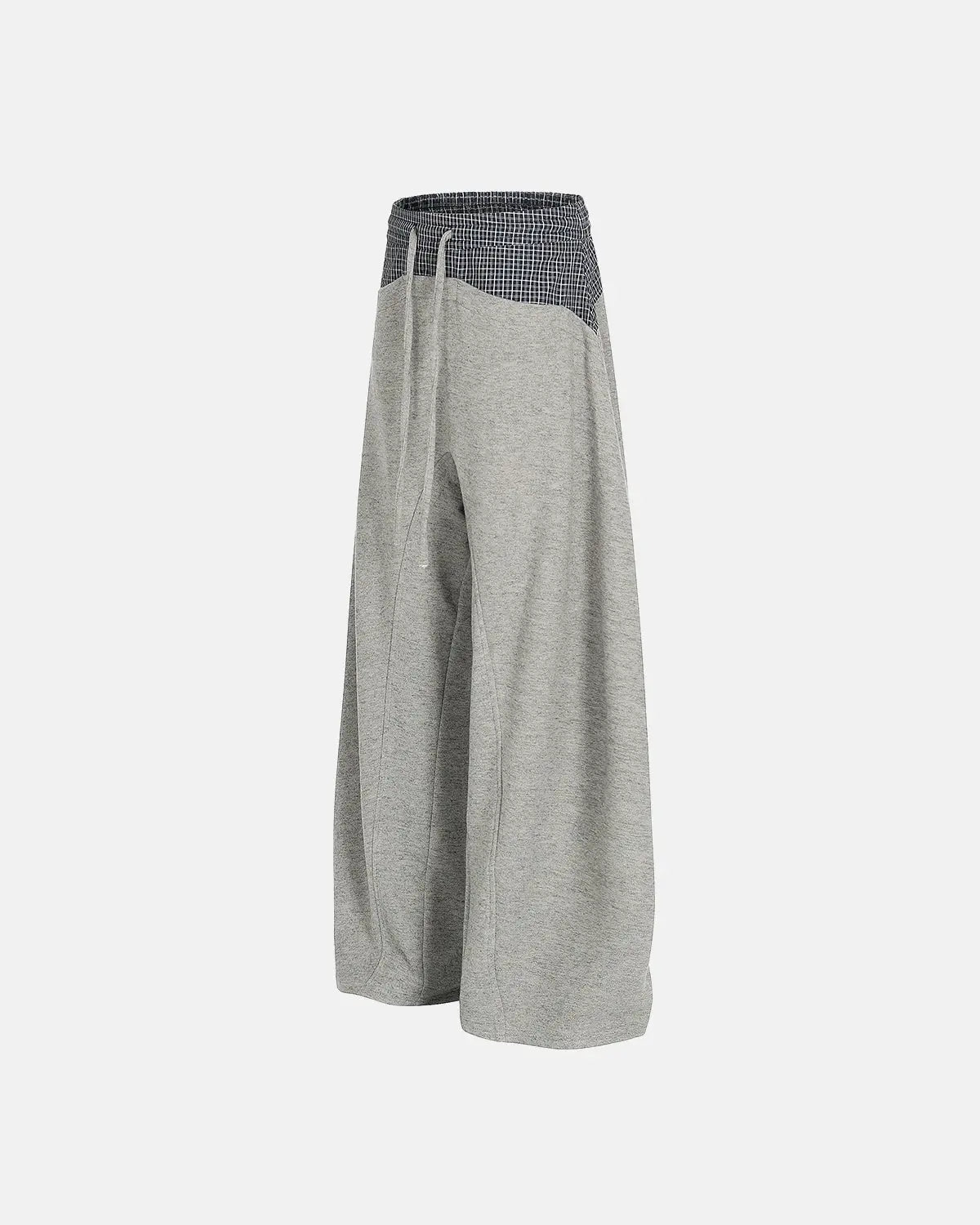 Plaid layered baggy sweatpants by INFLATION, featuring a relaxed fit and streetwear style with plaid pattern details.