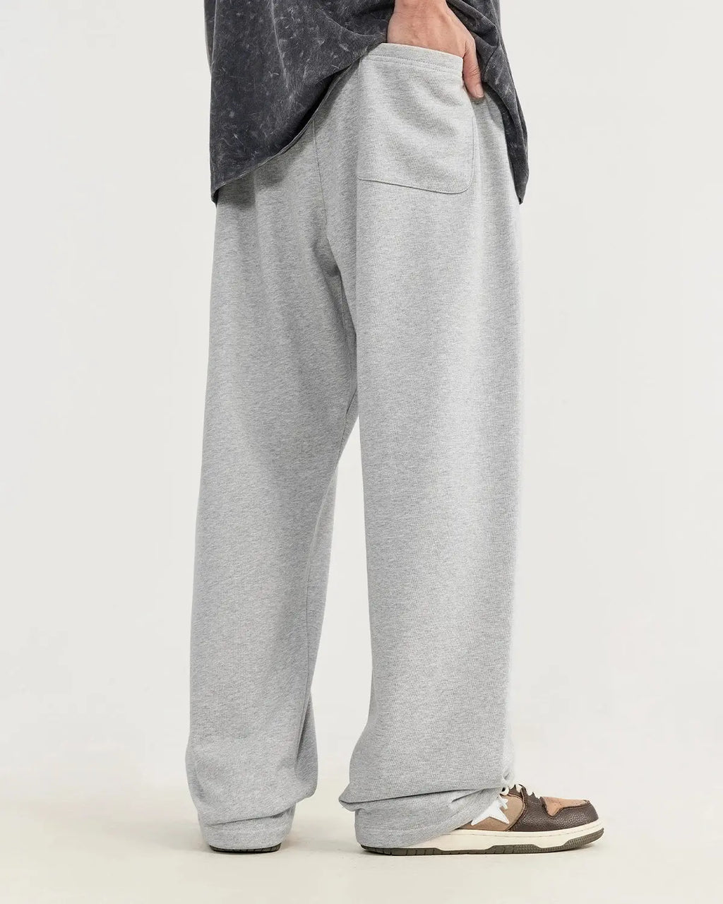 Heavyweight straight-leg sweatpants by INFLATION, featuring a relaxed fit and soft fabric in a neutral color.