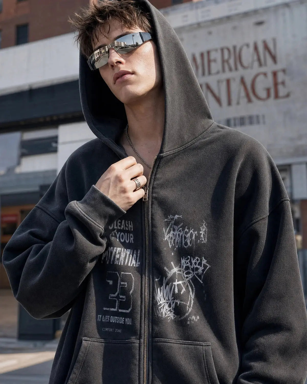 Graphic washed zip-up hoodie by Flation Streetwear, showing a casual hoodie with a faded graphic design and front zipper.