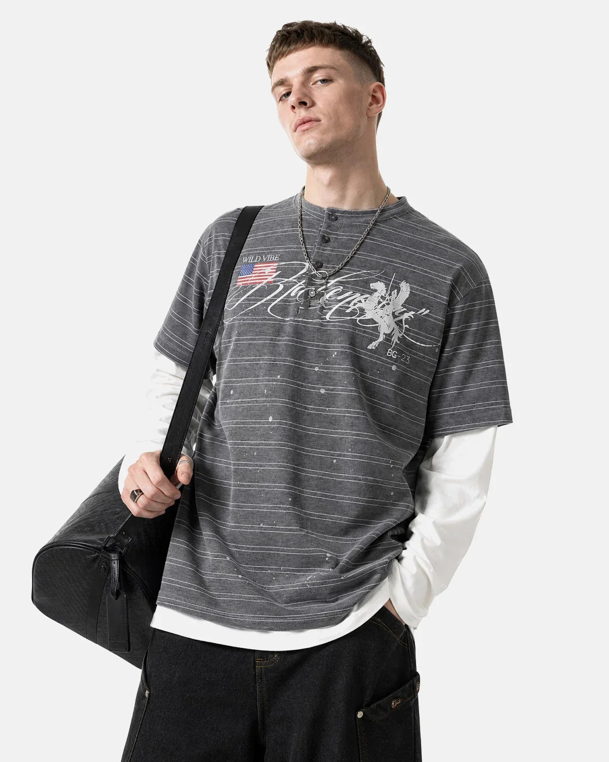 Layered Henley Stripe T-Shirt by INFLATION, featuring a casual striped design and layered neckline, worn by a model.
