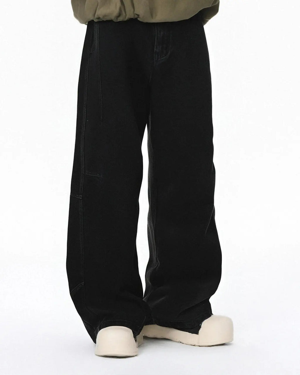 Acid washed black barrel jeans by Flation Streetwear with a relaxed fit and distressed finish, showcasing the textured denim fabric.