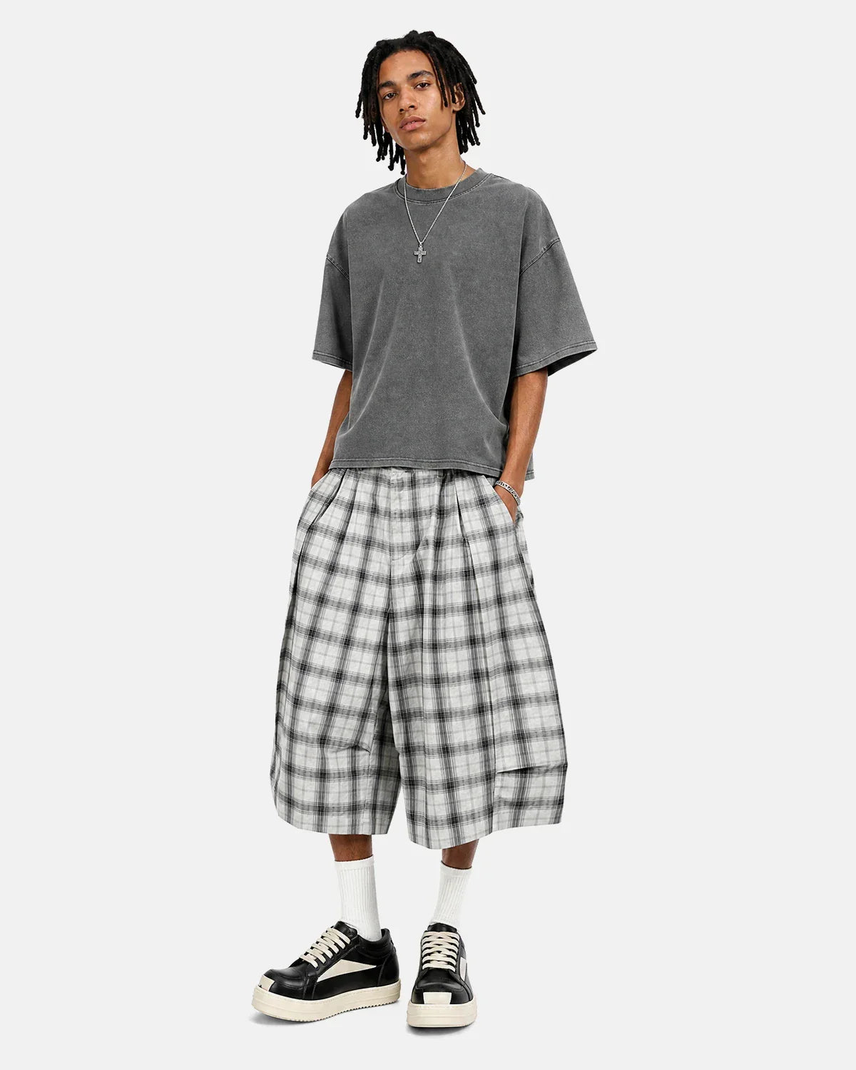 Inflation brand plaid longline casual shorts with a checkered pattern, featuring a relaxed fit and stylish design.
