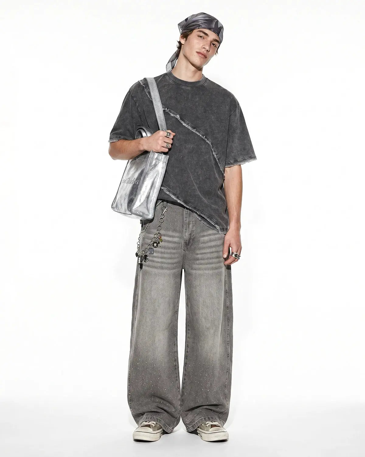 Raw edge deconstructed T-shirt by INFLATION Streetwear, showcasing distressed fabric and casual fit in a close-up image.