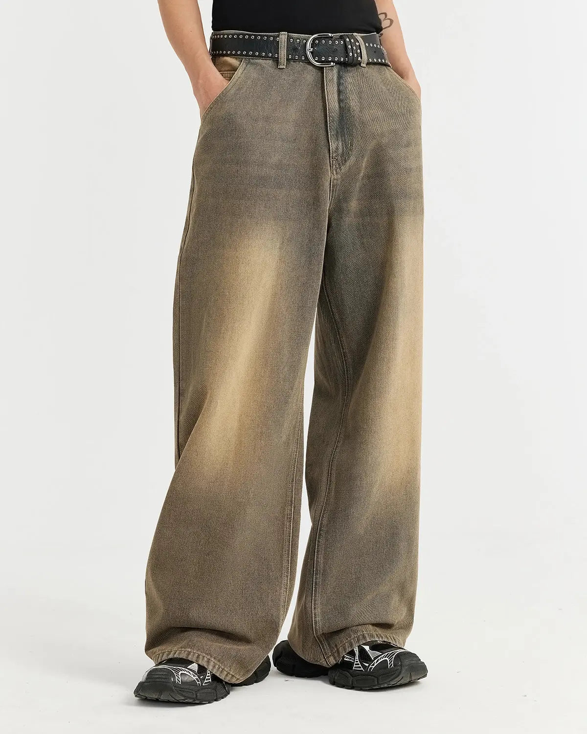 Brown acid wash baggy jeans from Flation Streetwear, featuring relaxed fit and distressed denim details.