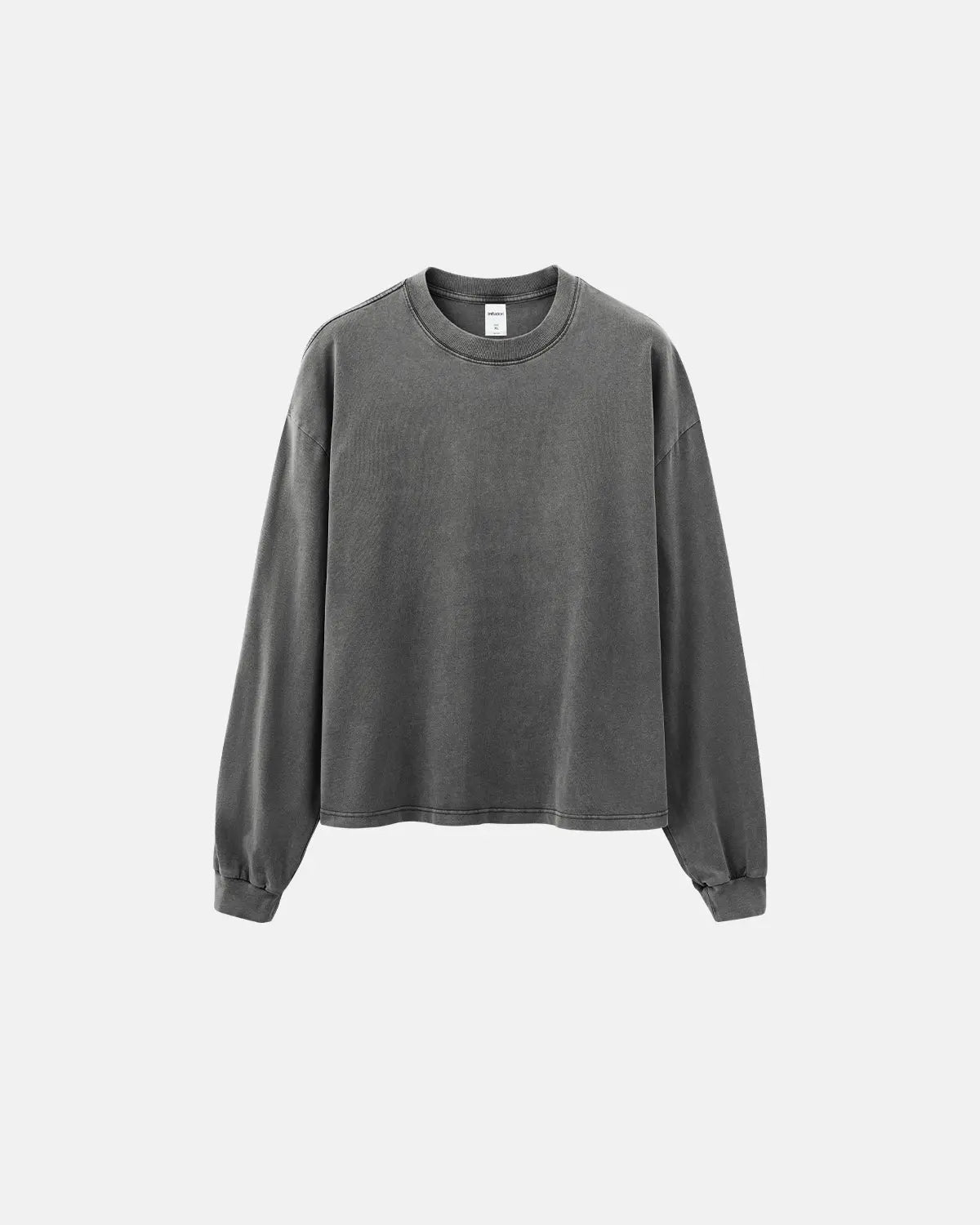 Distressed washed long sleeve tee by INFLATION, featuring a casual, vintage-style design with a relaxed fit and faded fabric.