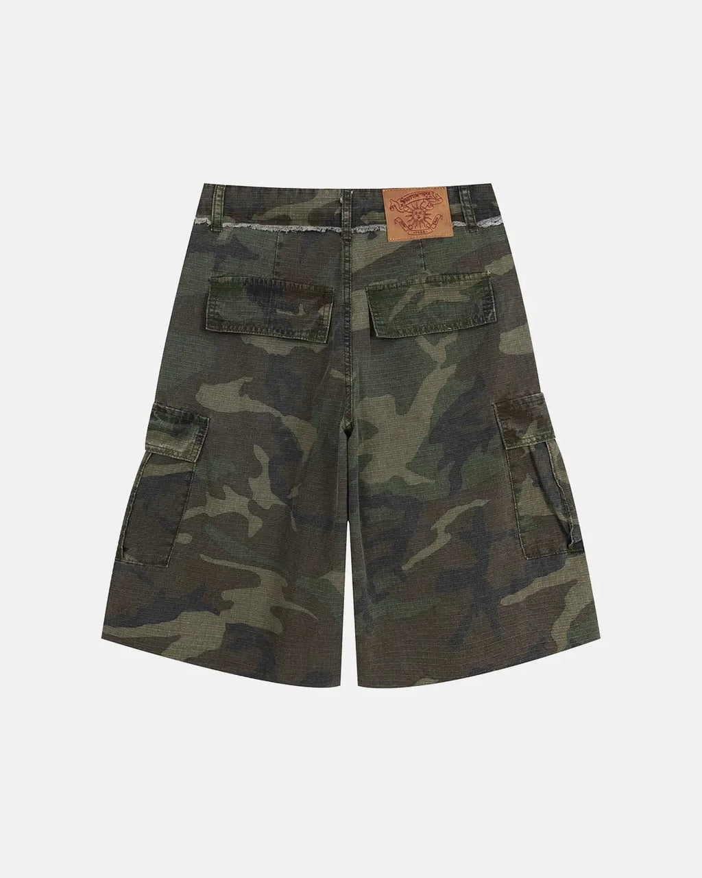 Camo utility longline shorts by INFLATION featuring a camouflage pattern, utility pockets, and a longline fit.