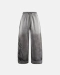 Acid washed Flation Streetwear sweatpants with relaxed fit and drawstring waist, showcasing the distressed, faded fabric texture.