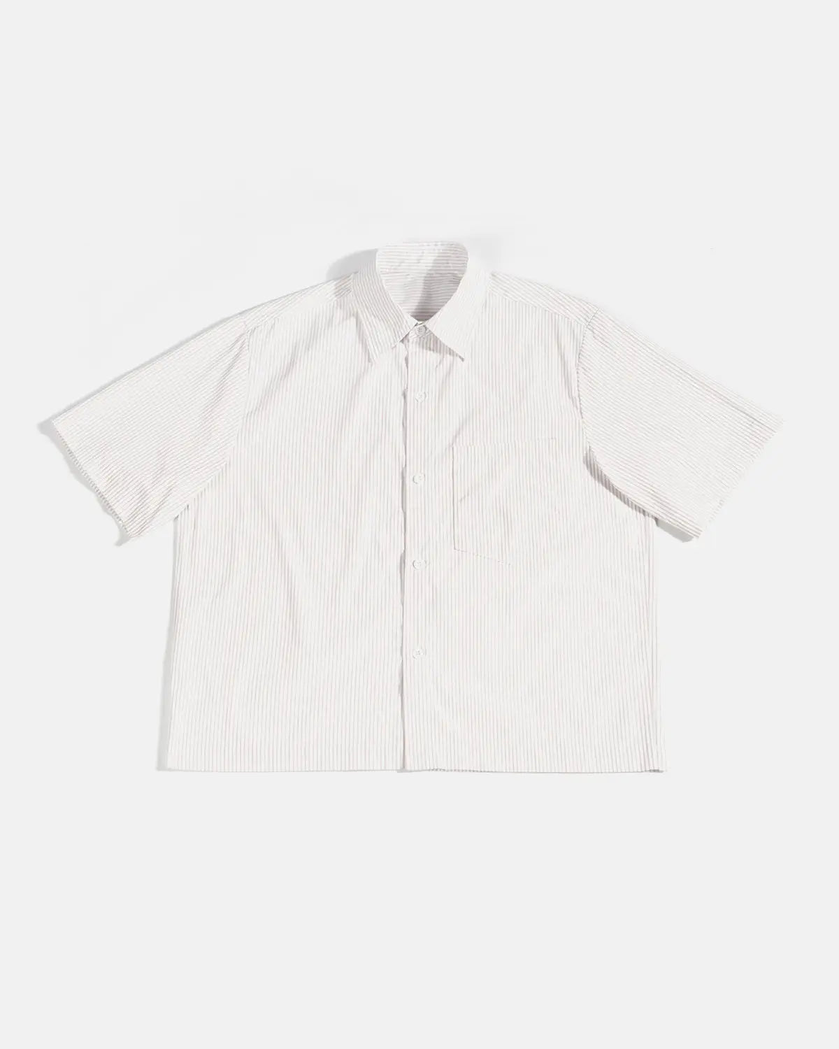 Inflation Streetwear boxy striped short-sleeve shirt with bold horizontal black and white stripes on lightweight fabric.