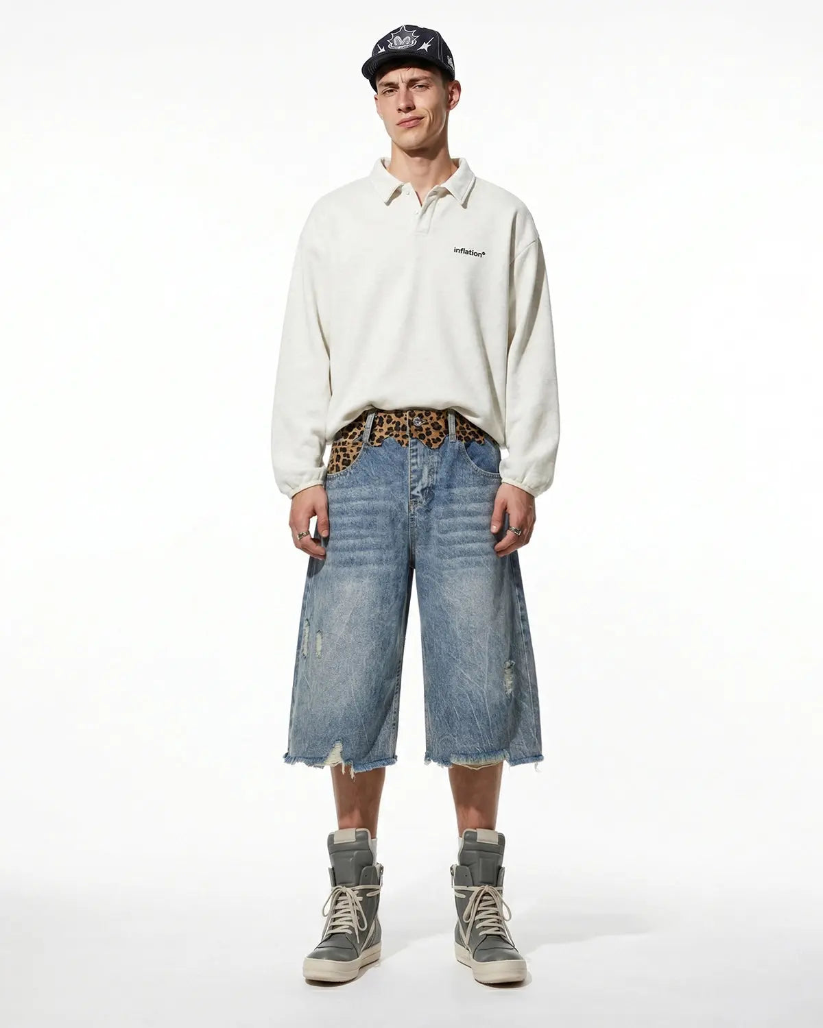 Leopard patchwork jorts by INFLATION, denim pants with leopard print patches, casual streetwear style, front view.