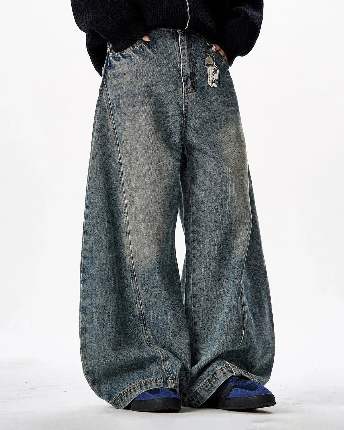Vintage Washed Barrel Jeans by INFLATION featuring distressed denim and relaxed fit, shown on a model.