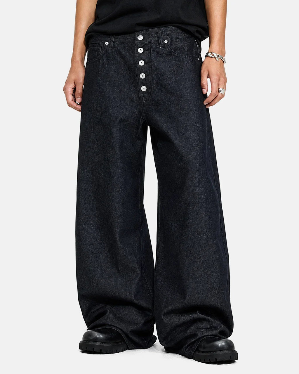 Inflation Streetwear Buttons Up Raw Baggy Jeans with distressed details and relaxed fit, shown on a model.