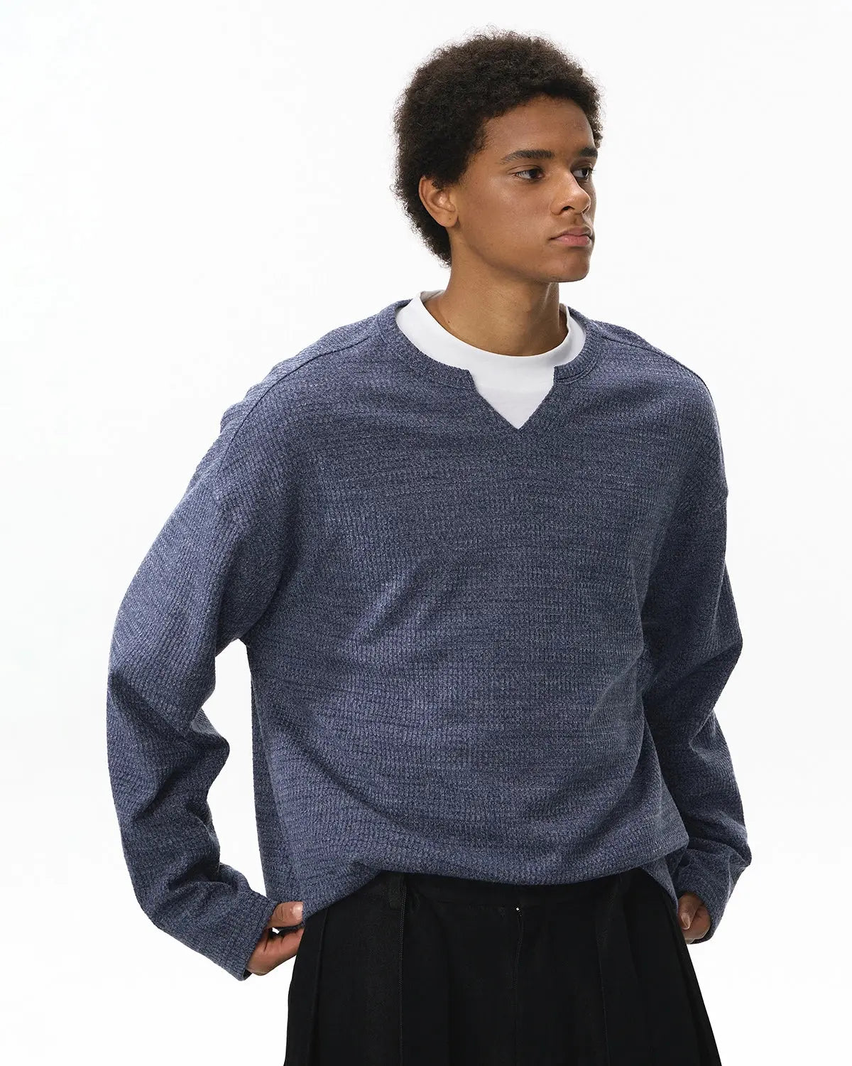 Black V-neck long sleeve waffle T-shirt by INFLATION Streetwear, featuring a fitted design and textured fabric.