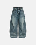 Inflation Whisker Acid Washed Barrel Jeans showing distressed denim, high-rise fit, and unique wash details on a model.