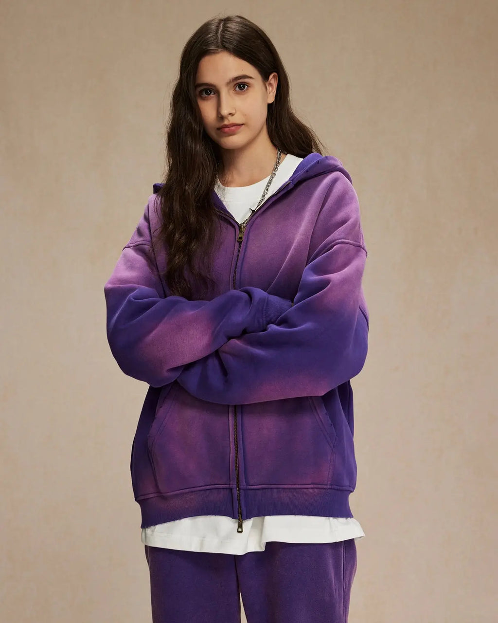 Acid washed zip-up hoodie by Flation Streetwear, showing a close-up of the distressed, faded fabric and front zipper detail.