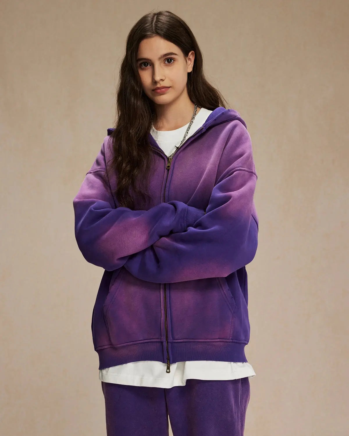 Acid washed zip-up hoodie by Flation Streetwear, showing a close-up of the distressed, faded fabric and front zipper detail.