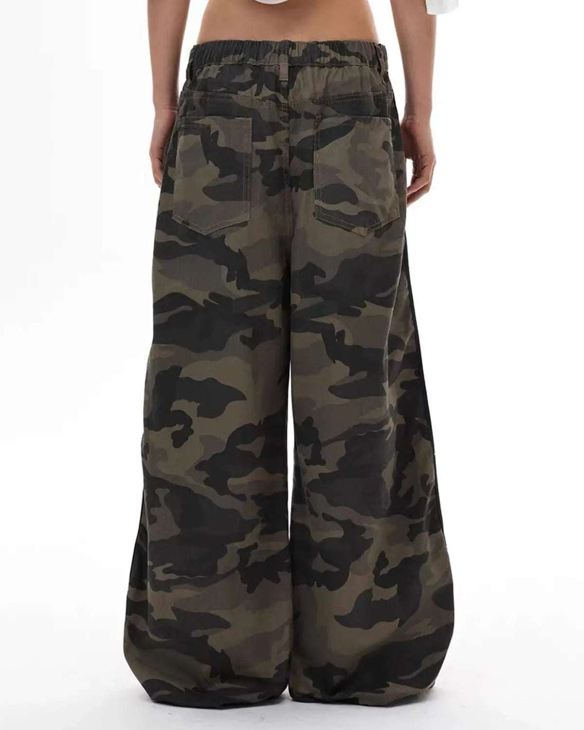 Inflation Camo Side Stripe Wide-Leg Pants with black and green camouflage pattern and side stripe detail.