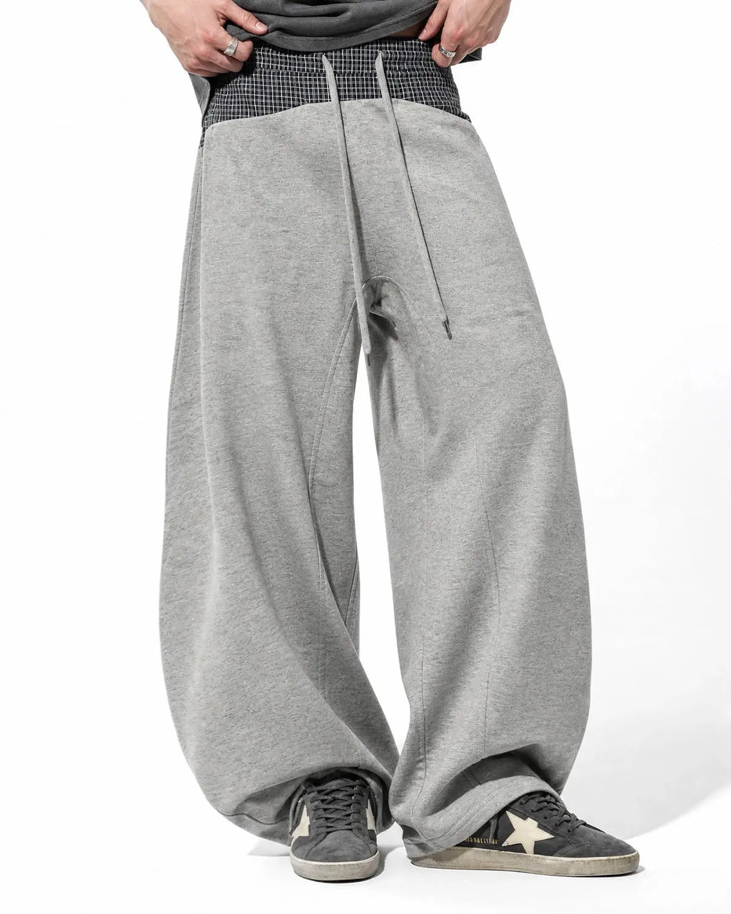 Plaid layered baggy sweatpants by INFLATION with a relaxed fit and layered design, perfect for streetwear casual style.
