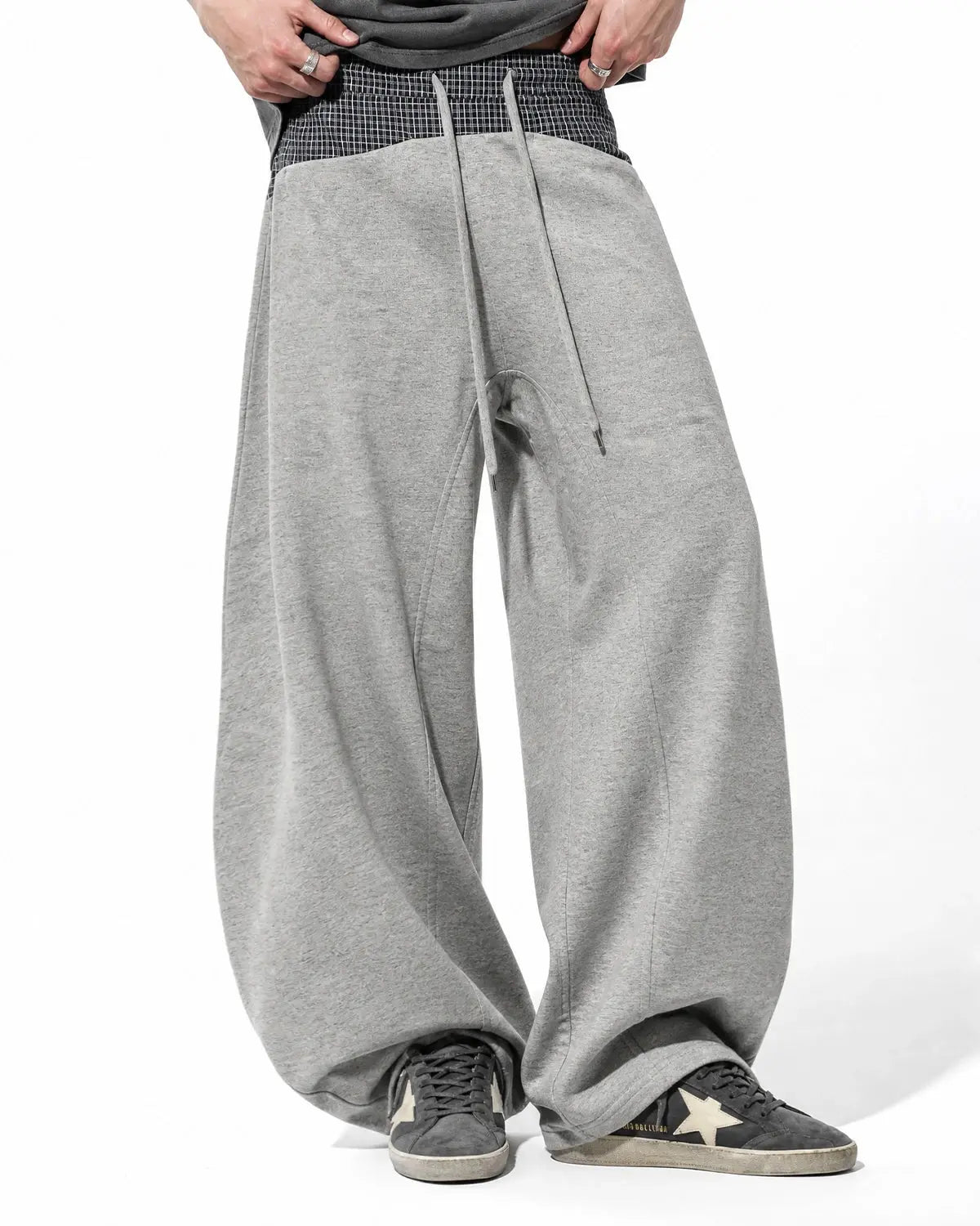 Plaid layered baggy sweatpants by INFLATION with a relaxed fit and layered design, perfect for streetwear casual style.