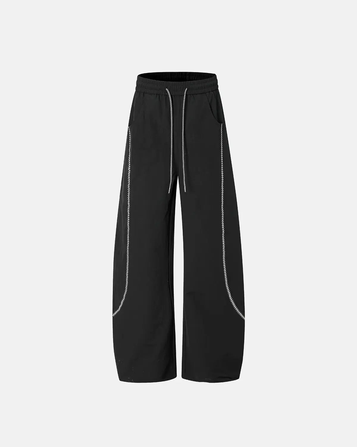 INFLATION AirFlow Contrast Embroidered Track Pants showing black fabric with colorful embroidered design and tapered fit.